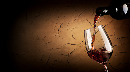 Image showing Pouring wine in cellar