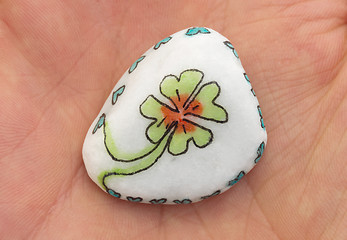 Image showing Stone with drawing of a clover four and small hearts