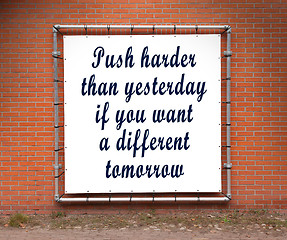 Image showing Large banner with inspirational quote on a brick wall