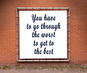 Image showing Large banner with inspirational quote on a brick wall