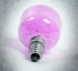 Image showing Old pink lightbulb isolated on a white background