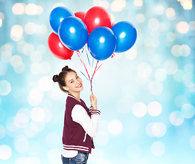 Image showing happy teenage girl with helium balloons