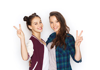 Image showing happy teenage girls hugging and showing peace sign