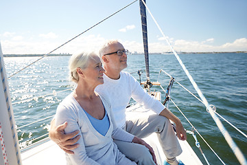 Image showing senior couple hugging on sail boat or yacht in sea