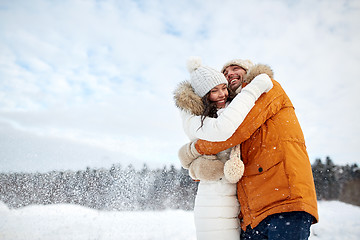 Image showing happy couple hugging and laughing in winter