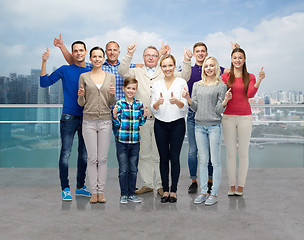 Image showing group of smiling people showing thumbs up