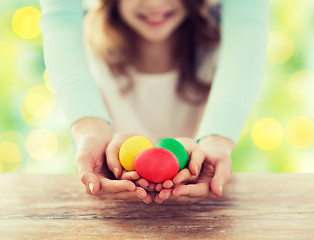 Image showing close up of happy family holding easter eggs