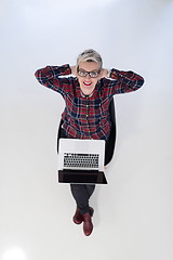 Image showing top view of young business woman working on laptop computer