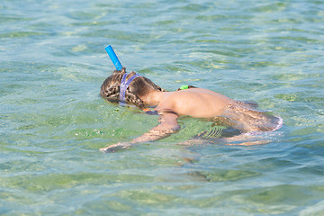 Image showing Girl swimming under water with mask and snorkel