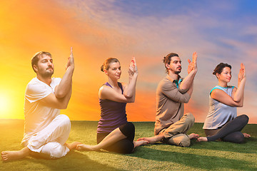 Image showing The group of people doing yoga exercises 