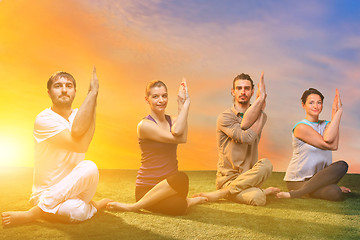 Image showing The group of people doing yoga exercises 