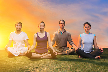 Image showing The group of people doing yoga exercises 