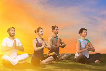 Image showing The group of people doing yoga exercises 