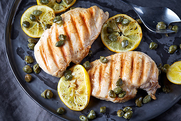 Image showing grilled chicken breasts on gray plate