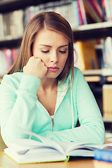 Image showing student girl reading book in library