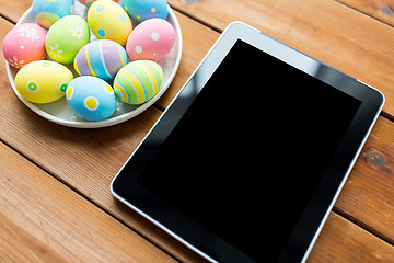 Image showing close up of easter eggs and blank tablet pc