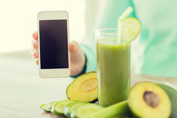 Image showing close up of woman with smartphone and vegetables