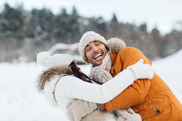 Image showing happy couple hugging and laughing in winter