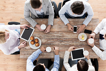Image showing close up of business team drinking coffee on lunch