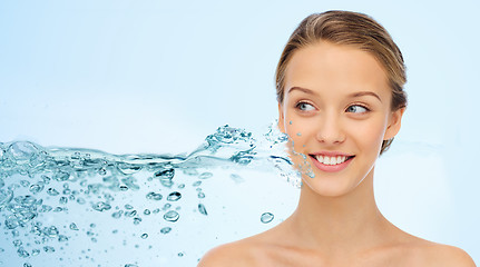 Image showing woman face and shoulders over water splash