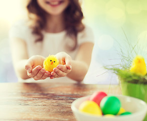 Image showing close up of girl holding easter chicken toy