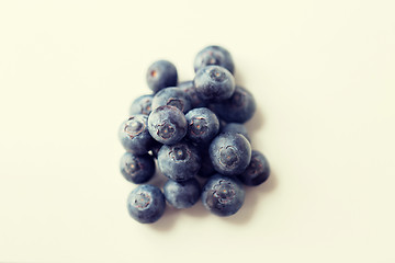 Image showing juicy fresh ripe blueberries on white