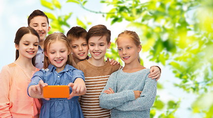 Image showing happy children talking selfie by smartphone