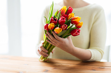 Image showing close up of woman holding tulip flowers