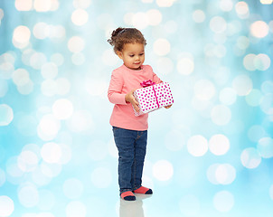 Image showing beautiful little baby girl with birthday present