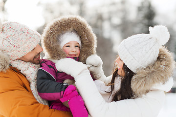 Image showing happy family with child in winter clothes outdoors