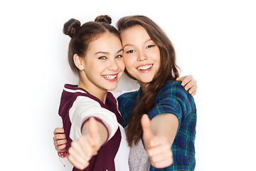 Image showing happy smiling teenage girls showing thumbs up