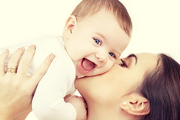 Image showing happy mother kissing baby