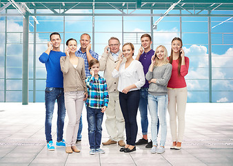 Image showing group of smiling people with smartphones