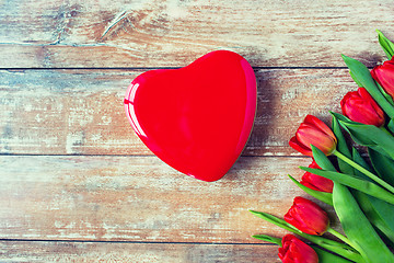 Image showing close up of red tulips and chocolate box