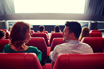 Image showing happy couple watching movie in theater or cinema