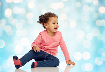 Image showing smiling little baby girl sitting on floor