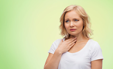 Image showing unhappy woman suffering from throat pain
