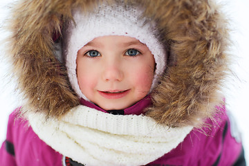 Image showing face of happy little kid or girl in winter clothes