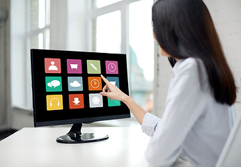 Image showing close up of woman with apps on computer in office