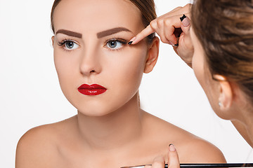 Image showing Beautiful female eyes with make-up and brush