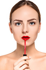 Image showing Beautiful female lips with make-up and brush