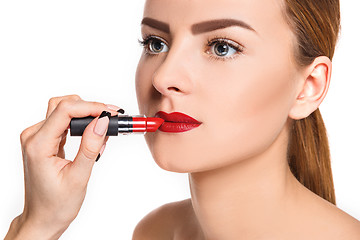 Image showing Beautiful female lips with make-up and brush