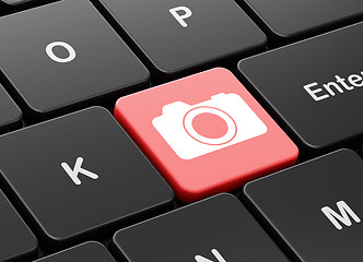 Image showing Tourism concept: Photo Camera on computer keyboard background