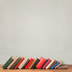 Image showing Old books on wooden floor