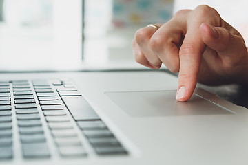 Image showing woman\'s hands working on laptop computer