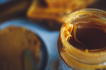 Image showing Open jar of peanut butter 