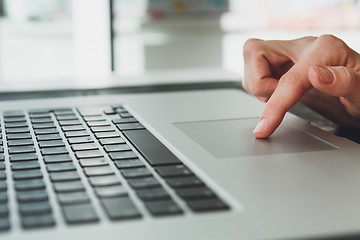 Image showing woman\'s hands working on laptop computer