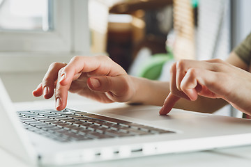 Image showing woman\'s hands working on laptop computer