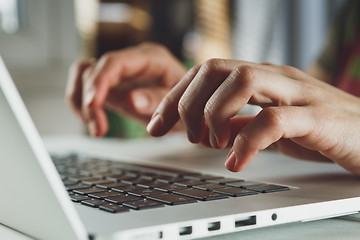 Image showing woman\'s hands working on laptop computer