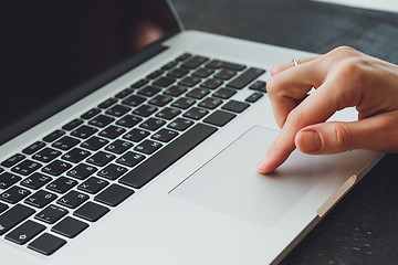 Image showing woman\'s hands working on laptop computer